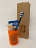 Junior-Zahnpflegebeutel orange mit Zahnbürste Modell Magic Black im Papierbeutel
