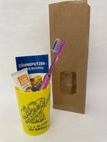 Junior-Zahnpflegebeutel gelb mit Zahnbürste Modell E im Papierbeutel