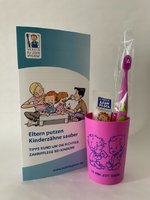 Baby-Zahnpflegebeutel pink mit Zahnbürste Modell Mini im Kordelzugbeutel