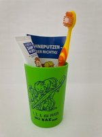 KIGA-Zahnpflegebeutel grün mit Zahnbürste Modell Happy im Kordelzugbeutel